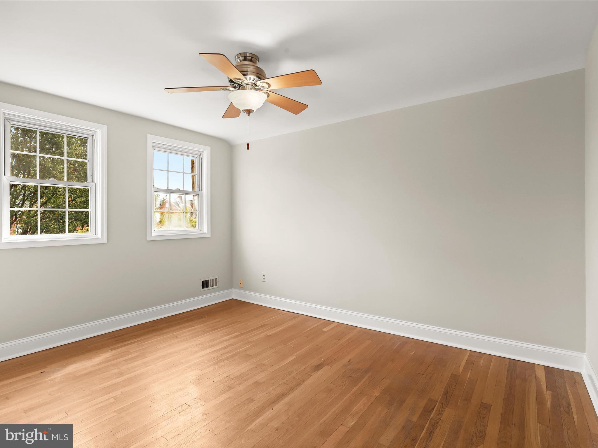 8328 Wyton Road Towson, MD 21286 - Photo 15 of 36 wooden floor in an empty room with a window