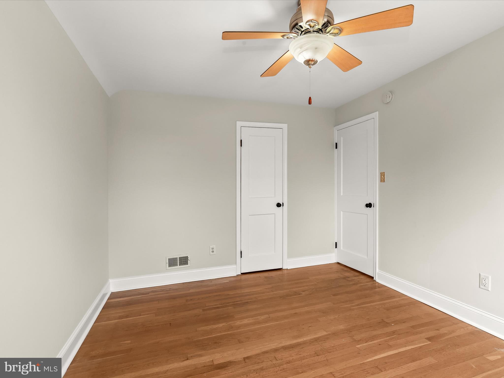 8328 Wyton Road Towson, MD 21286 - Photo 16 of 36 a view of empty room with wooden floor