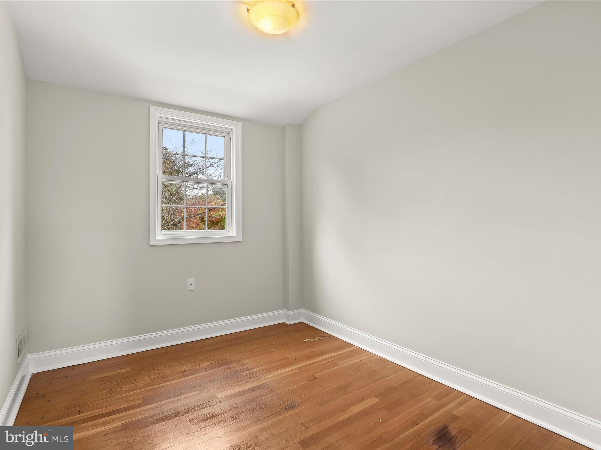 8328 Wyton Road Towson, MD 21286 - Photo 18 of 36 a view of empty room with wooden floor and fan