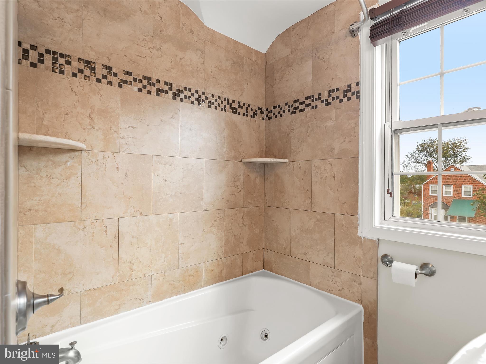 8328 Wyton Road Towson, MD 21286 - Photo 20 of 36 a bathroom with a bathtub and a shower