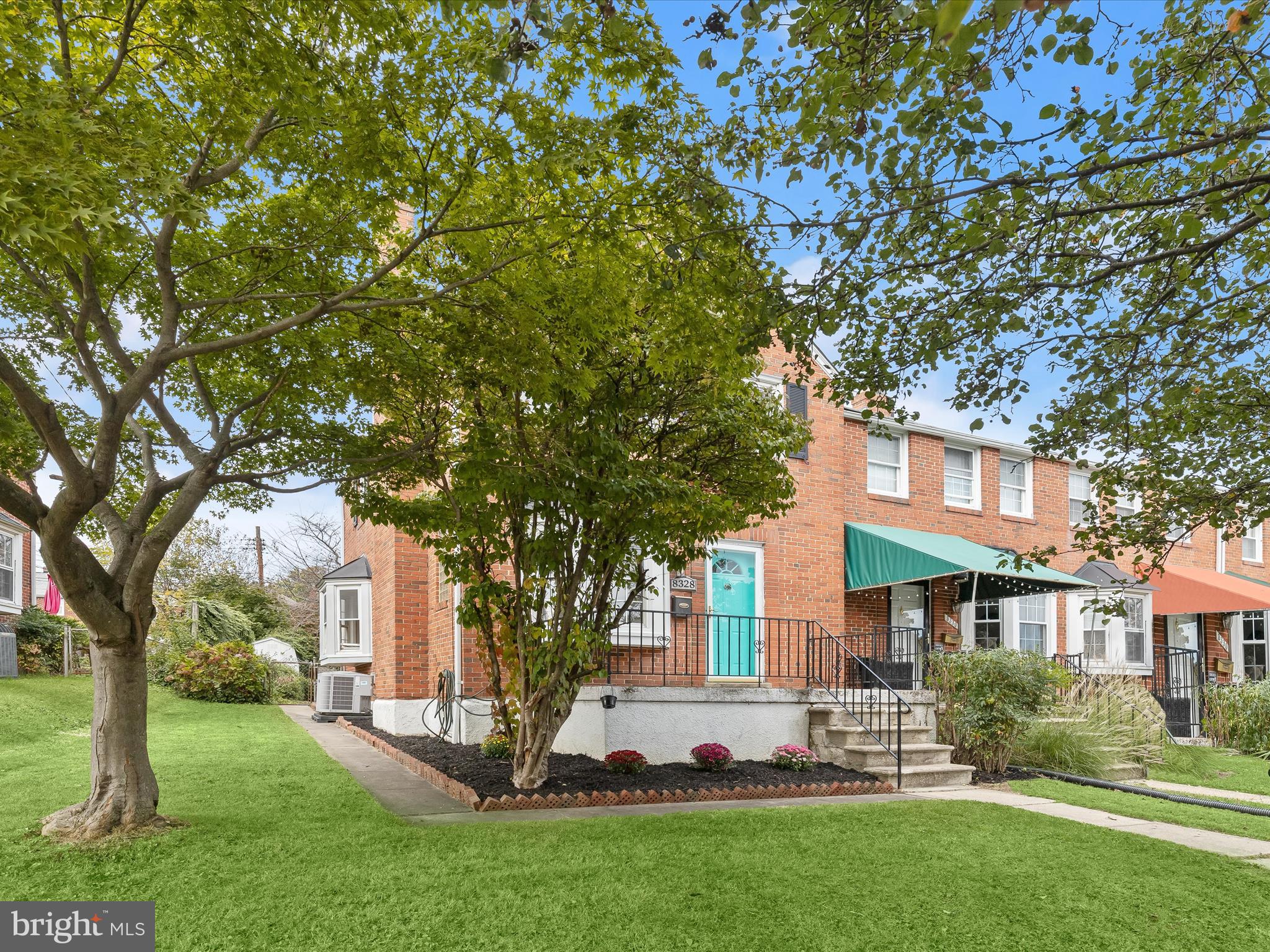 8328 Wyton Road Towson, MD 21286 - Photo 2 of 36 a front view of a house with a garden