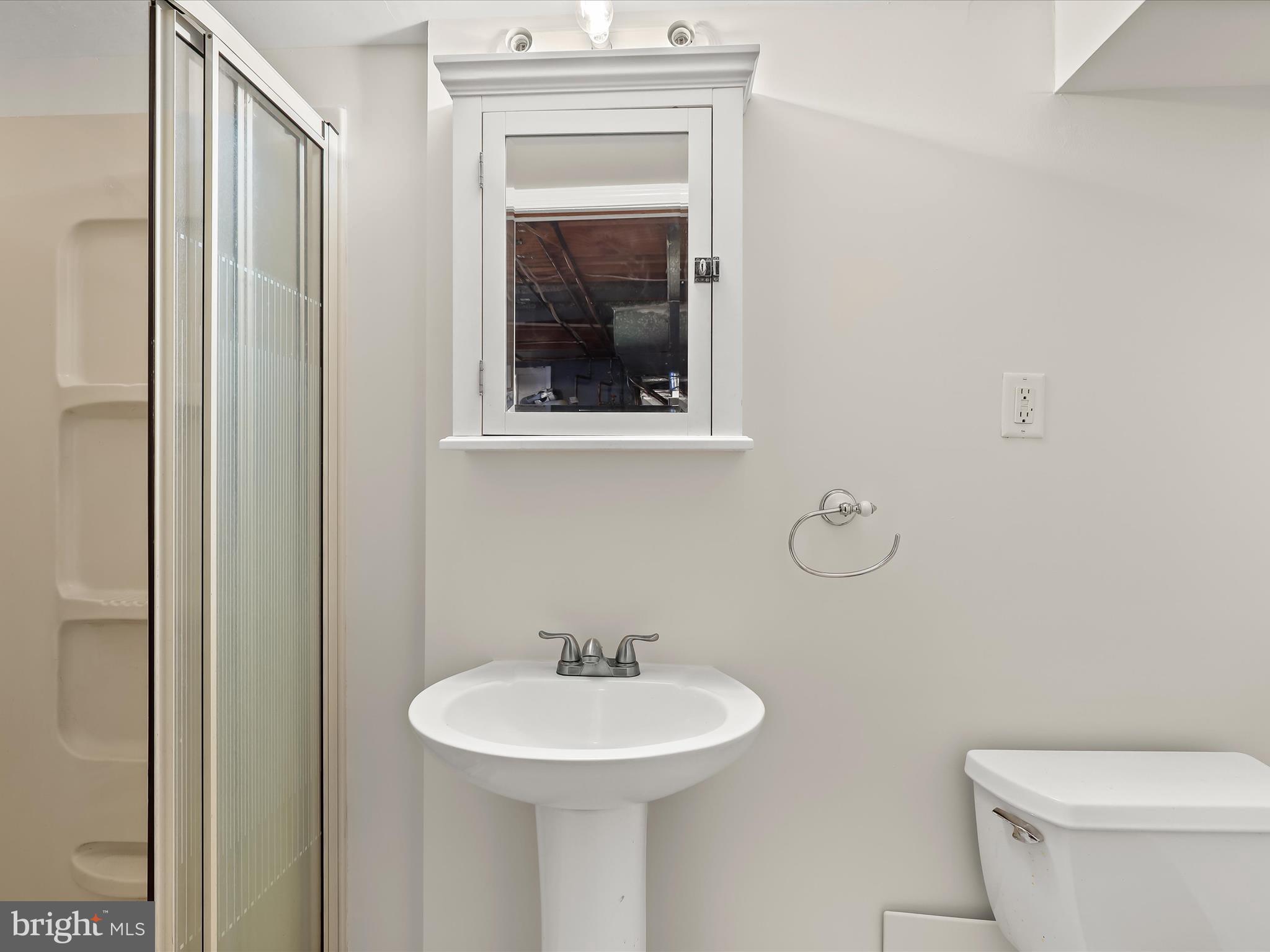 8328 Wyton Road Towson, MD 21286 - Photo 24 of 36 a bathroom with a toilet a sink and a mirror