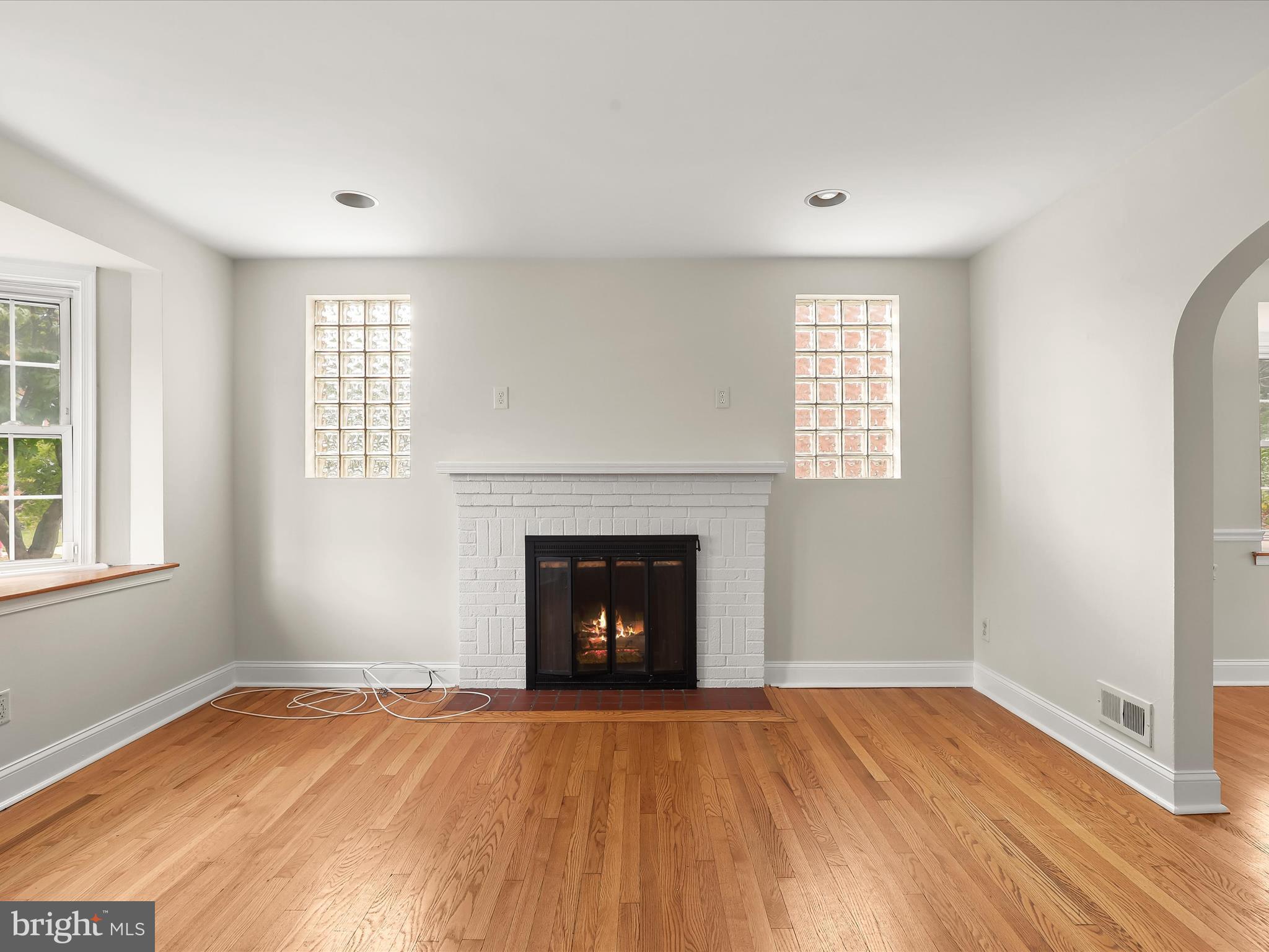 8328 Wyton Road Towson, MD 21286 - Photo 7 of 36 an empty room with windows and fireplace