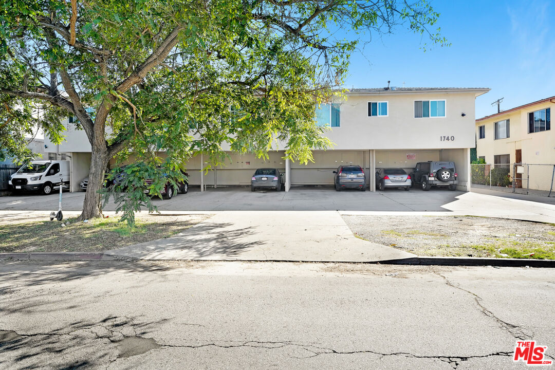 1740 Hauser Boulevard, Unit 8 Los Angeles, CA 90019 - Photo 2 of 10 a view of a car park in front of house