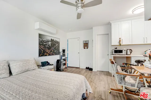 a bedroom with a bed and a cabinets