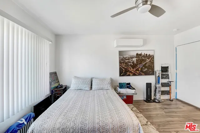 a bedroom with a bed and a table