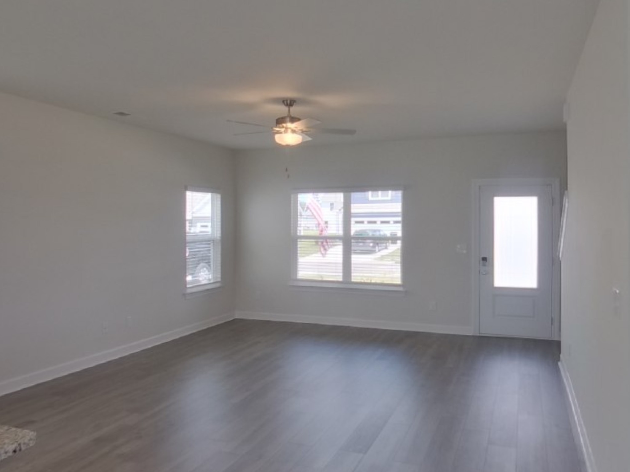 2410 Valverde Way Murfreesboro, TN 37127 - Photo 3 of 16 an empty room with wooden floor and windows