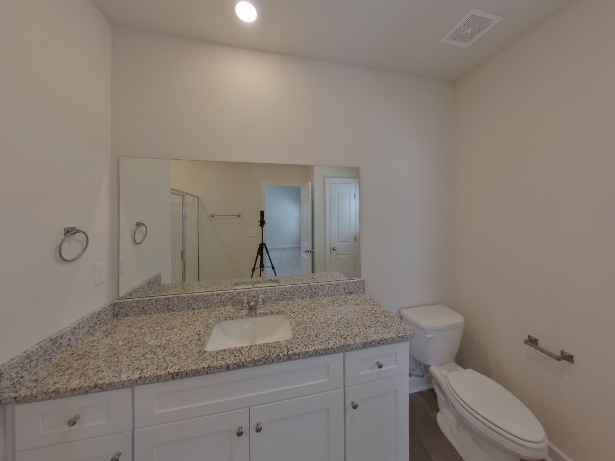 2410 Valverde Way Murfreesboro, TN 37127 - Photo 8 of 16 a bathroom with a granite countertop sink a toilet and a mirror