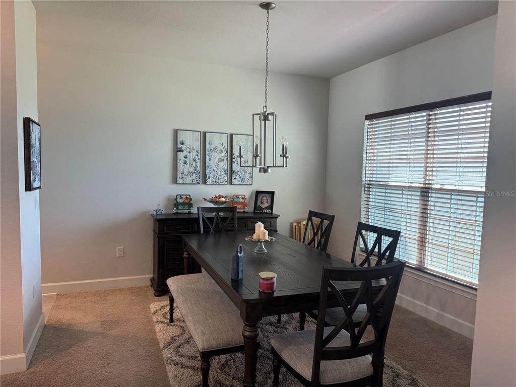 5123 Southwest 91st Street Ocala, FL 34476 - Photo 13 of 29 a view of a dining room with furniture