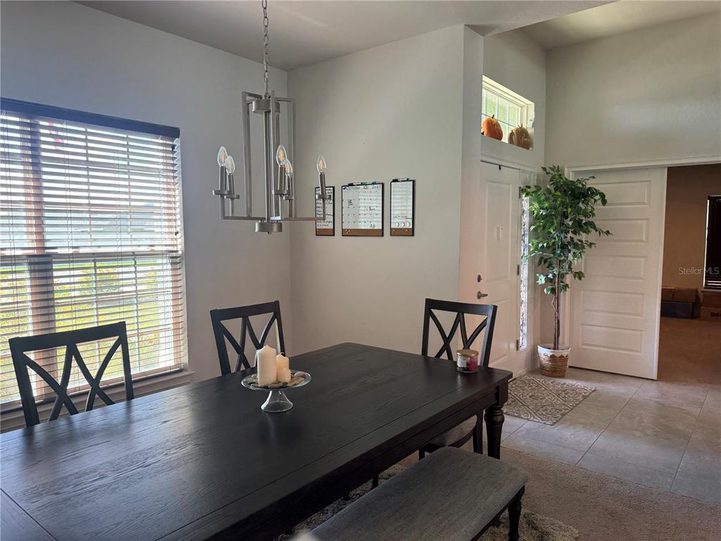 5123 Southwest 91st Street Ocala, FL 34476 - Photo 14 of 29 a view of a workspace with furniture and a potted plant