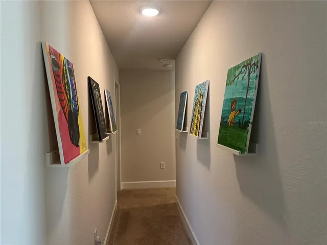 a bedroom with furniture and a flat screen tv