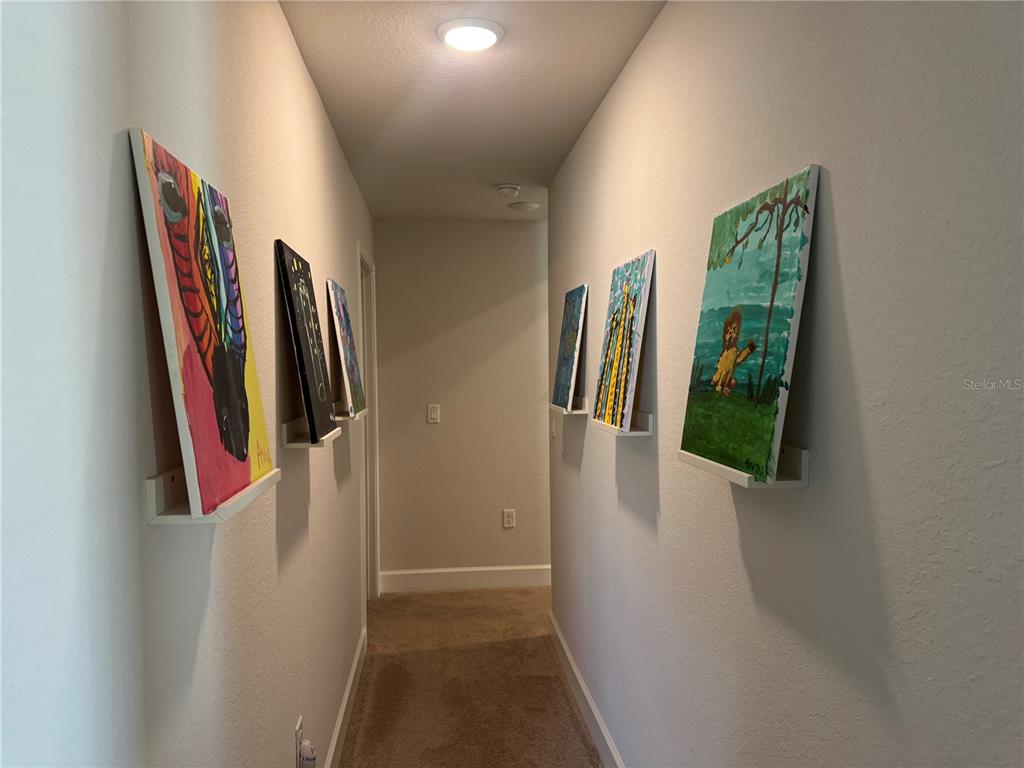 5123 Southwest 91st Street Ocala, FL 34476 - Photo 23 of 29 a view of walk in closet with clothes