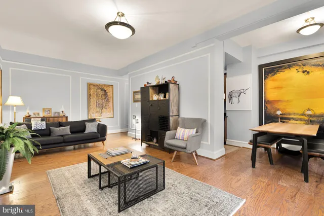 a view of a dining room with furniture and a window