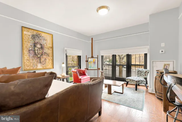 a bedroom with a bed and a table in it