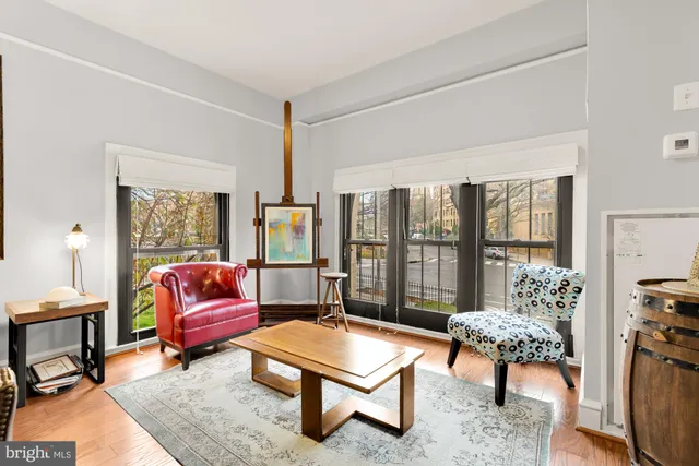 an aerial view of a house with garden space and swimming pool