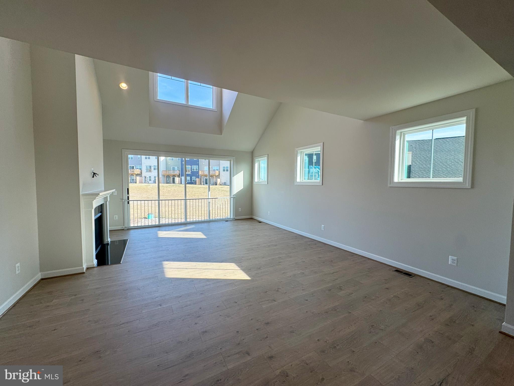 115 Sapphire Street Stephenson, VA 22656 - Photo 13 of 36 wooden floor in an empty room with a window