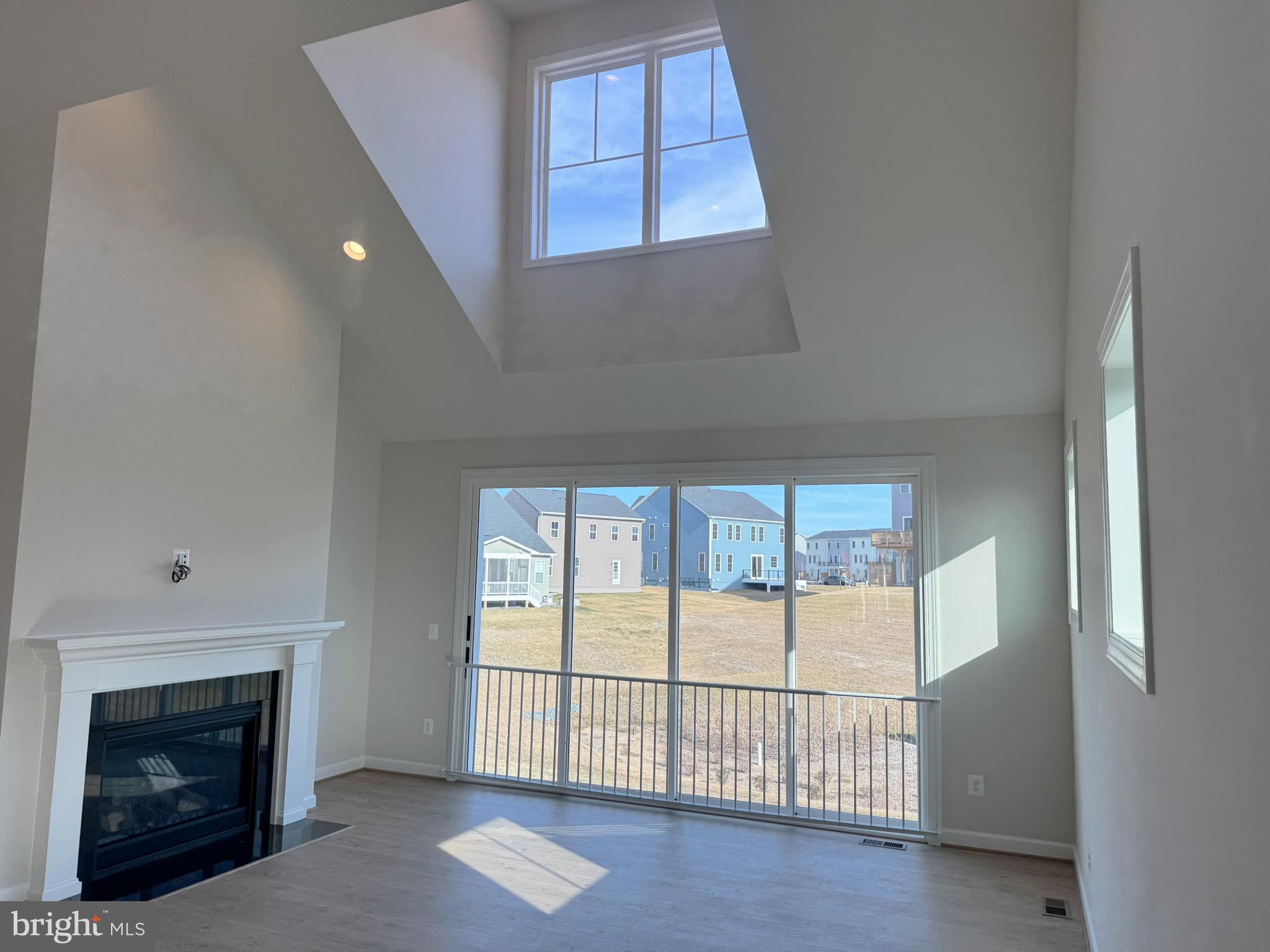 115 Sapphire Street Stephenson, VA 22656 - Photo 15 of 36 a view of a livingroom with a fireplace and window