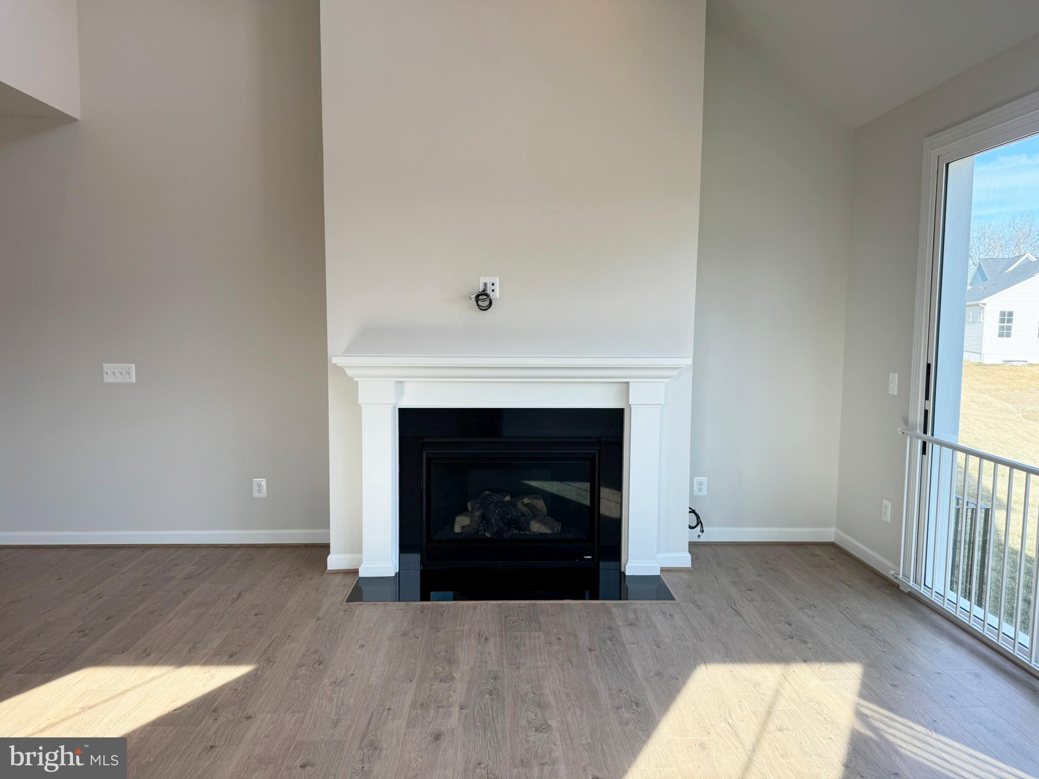 115 Sapphire Street Stephenson, VA 22656 - Photo 16 of 36 a living room with a fireplace and a fireplace