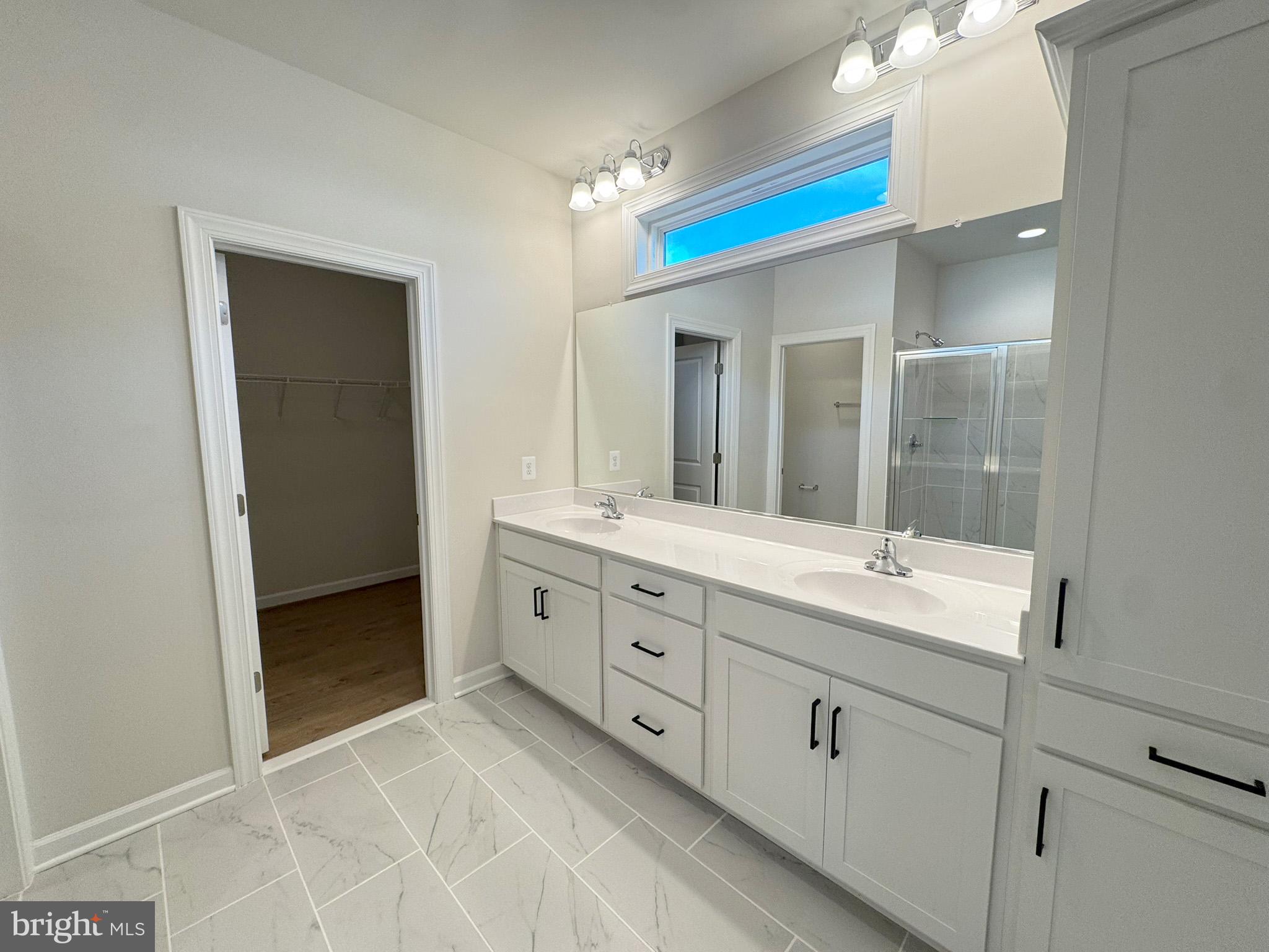 115 Sapphire Street Stephenson, VA 22656 - Photo 21 of 36 a spacious bathroom with a double vanity sink mirror and double