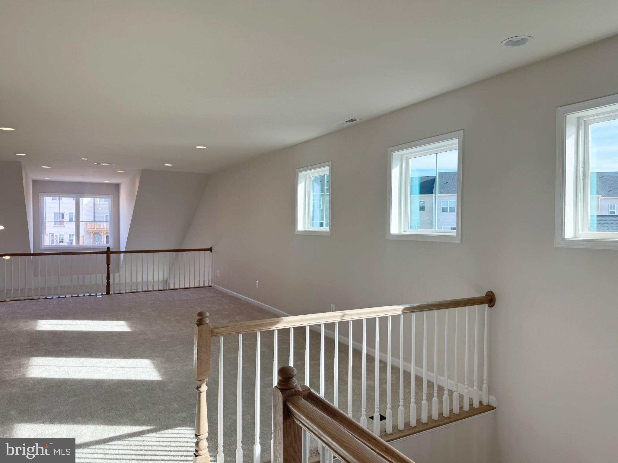 115 Sapphire Street Stephenson, VA 22656 - Photo 26 of 36 a view of a hallway with windows