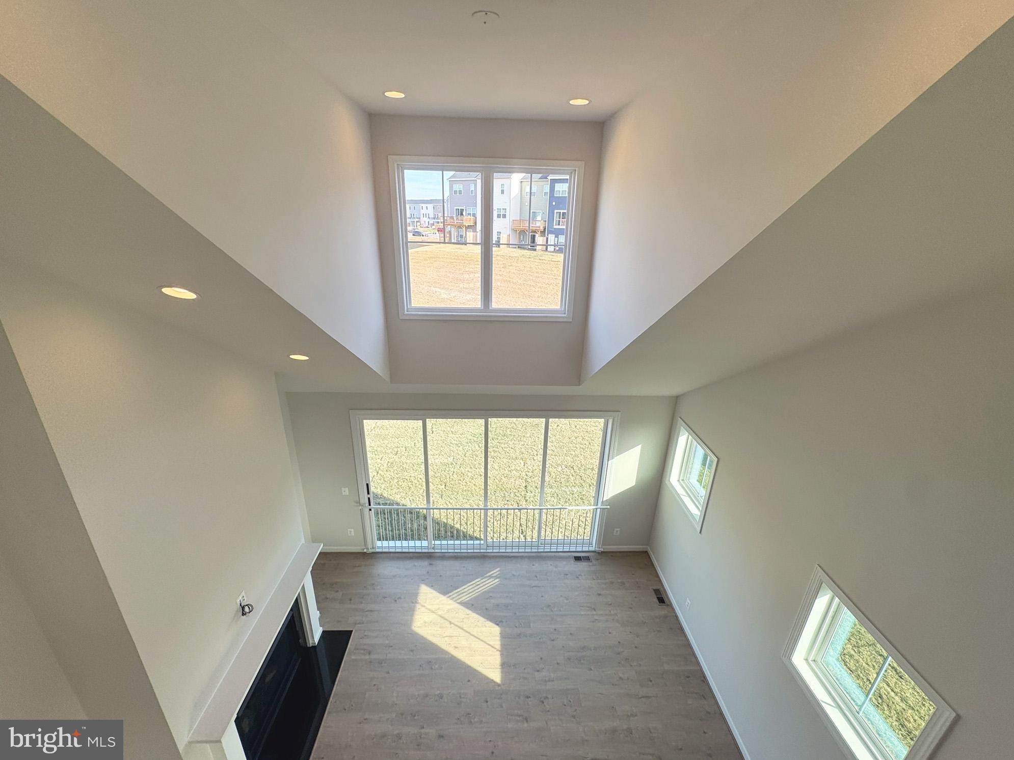 115 Sapphire Street Stephenson, VA 22656 - Photo 28 of 36 a view of livingroom with a window and wooden floor