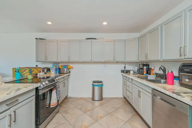a kitchen with a sink and cabinets