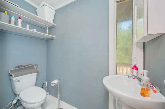 a view of a kitchen with many windows