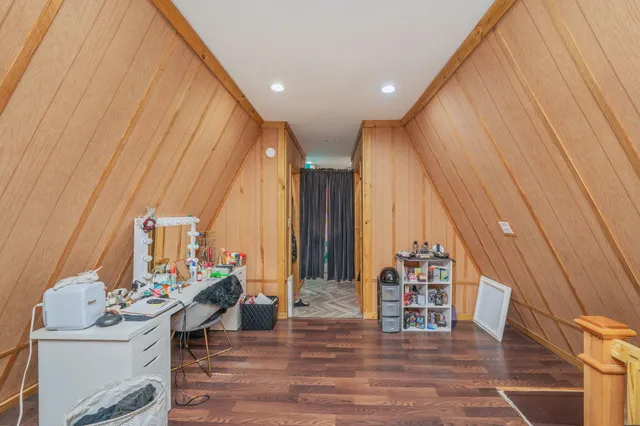 a view of a bedroom with closet and furniture