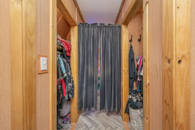 a view of an entryway with wooden floor