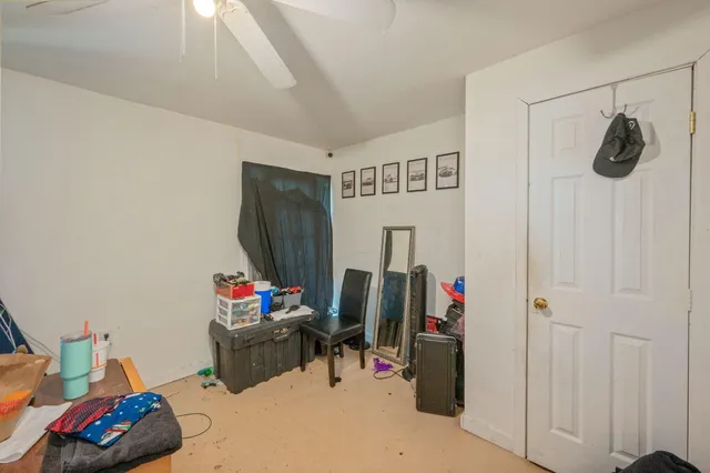 a bedroom with furniture and a bed