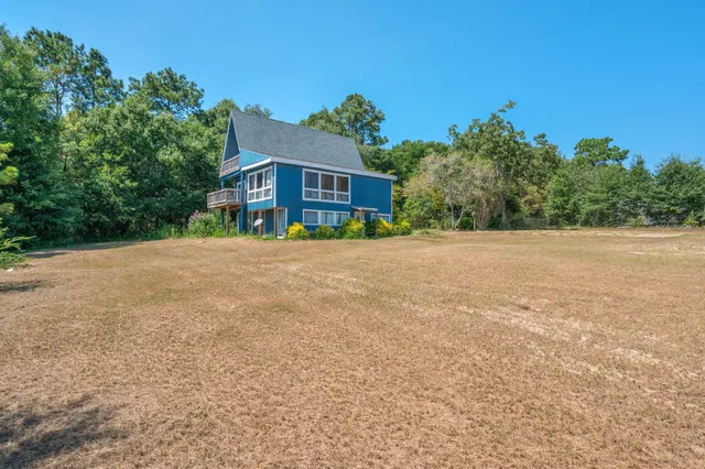 a backyard of a house with lots of green space