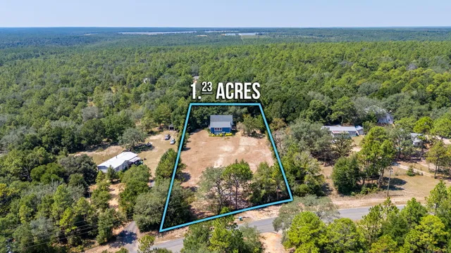 a view of a swimming pool with a yard