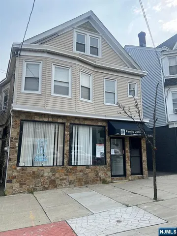a living room with a couch and a large window