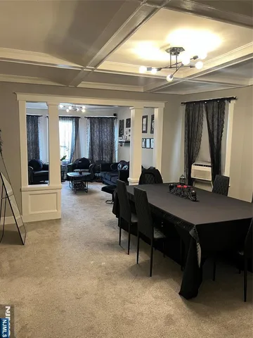 a bedroom with a black and white wall