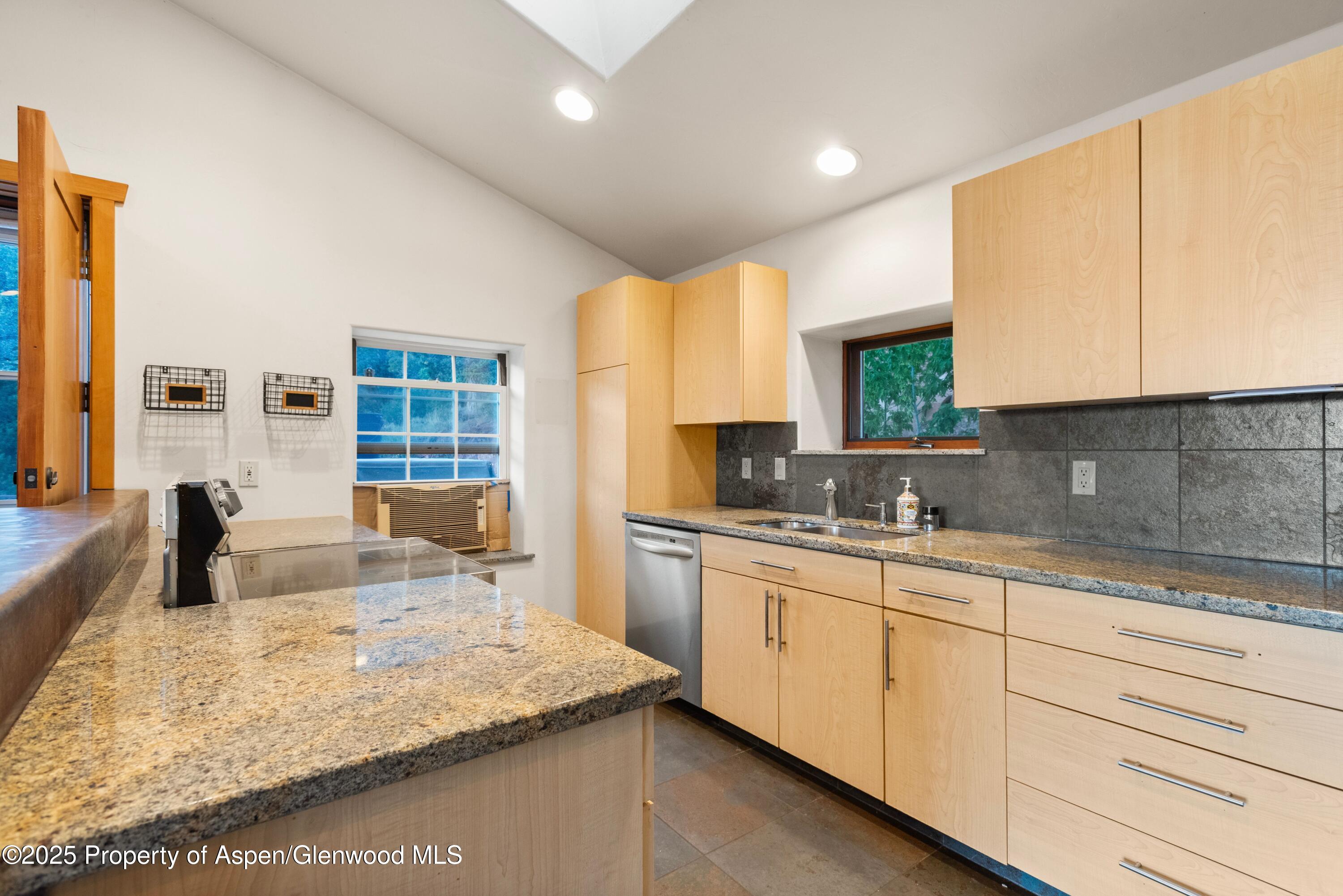 2800 Cedar Drive Basalt, CO 81621 - Photo 12 of 28 a kitchen with stainless steel appliances granite countertop a sink stove and cabinets