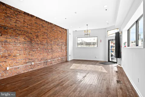 a view of an empty room and a window