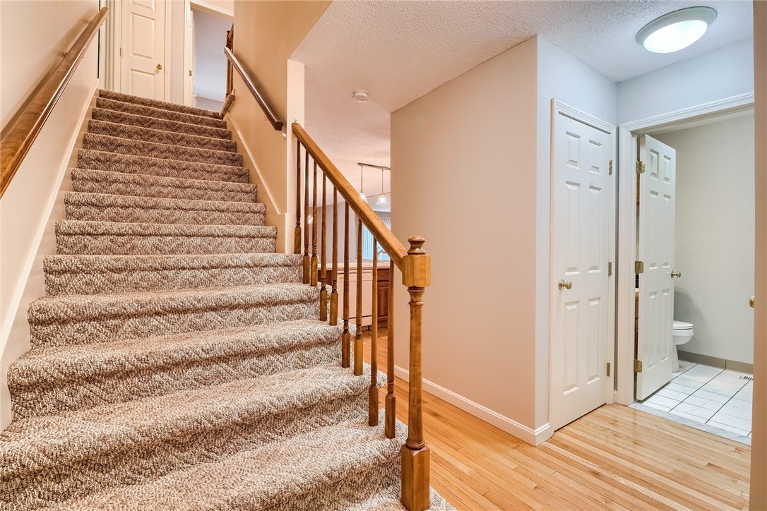 4 Smithfield Road, Unit 40 North Providence, RI 02904 - Photo 12 of 14 Nice wide staircase leading upstairs to 2 beds and full bath