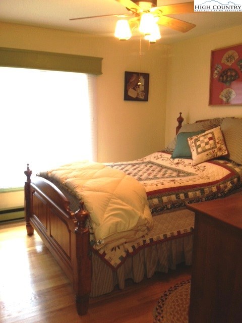 1292 Ben Miller Road Deep Gap, NC 28618 - Photo 11 of 31 a bedroom with a bed and a cabinets