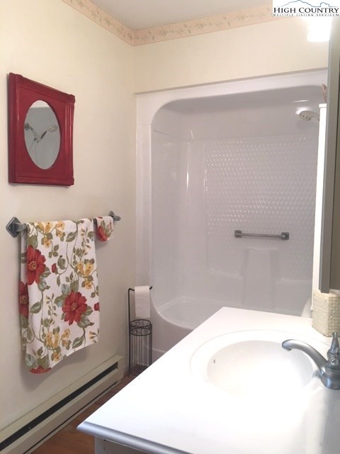 1292 Ben Miller Road Deep Gap, NC 28618 - Photo 12 of 31 a bathroom with a bathtub and a shower