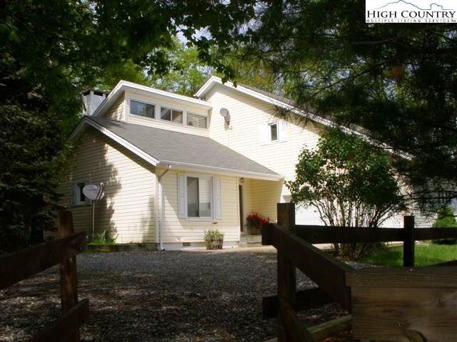 1292 Ben Miller Road Deep Gap, NC 28618 - Photo 2 of 31 a front view of a house with garden