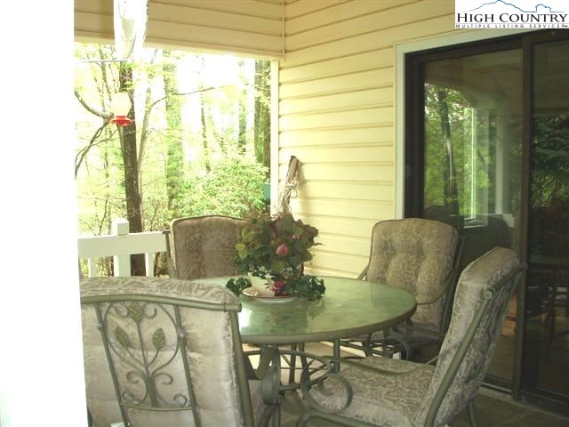 1292 Ben Miller Road Deep Gap, NC 28618 - Photo 21 of 31 a view of a dining room with furniture window and outside view