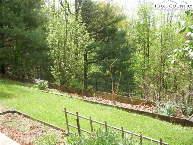 1292 Ben Miller Road Deep Gap, NC 28618 - Photo 23 of 31 a view of an outdoor space and a yard