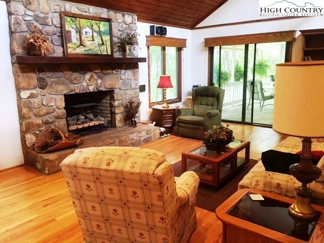 1292 Ben Miller Road Deep Gap, NC 28618 - Photo 5 of 31 a living room with furniture and a fireplace