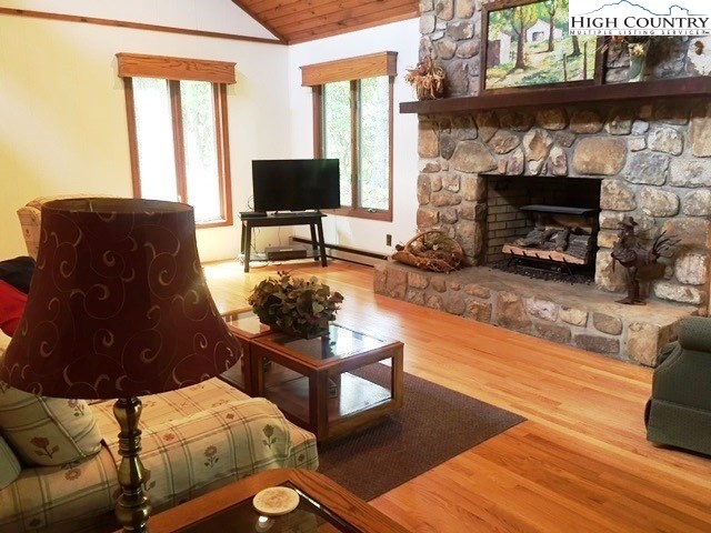 1292 Ben Miller Road Deep Gap, NC 28618 - Photo 6 of 31 a living room with furniture and a fireplace