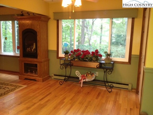 1292 Ben Miller Road Deep Gap, NC 28618 - Photo 8 of 31 a view of a room with wooden floor and windows