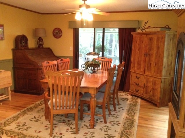 1292 Ben Miller Road Deep Gap, NC 28618 - Photo 10 of 31 a view of a dining room with furniture and chandelier
