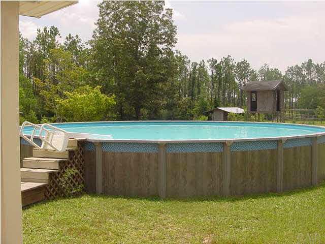 2551 Renfroe Road Pace, FL 32571 - Photo 2 of 14 Above Ground Pool, just off wooden deck.