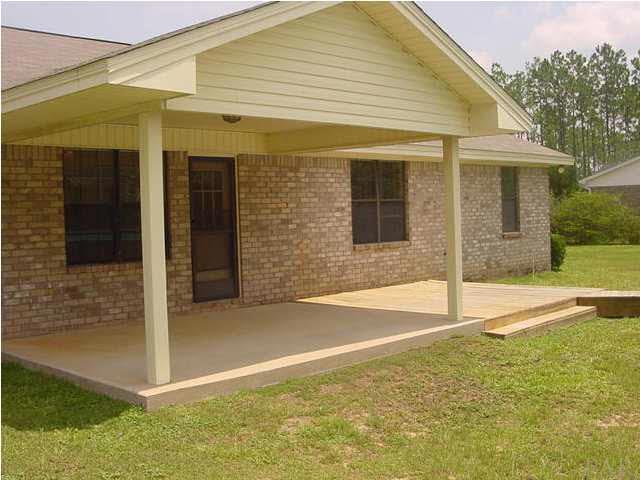 2551 Renfroe Road Pace, FL 32571 - Photo 3 of 14 11.5'x 18' Covered Porch with Wooden Deck to Right.