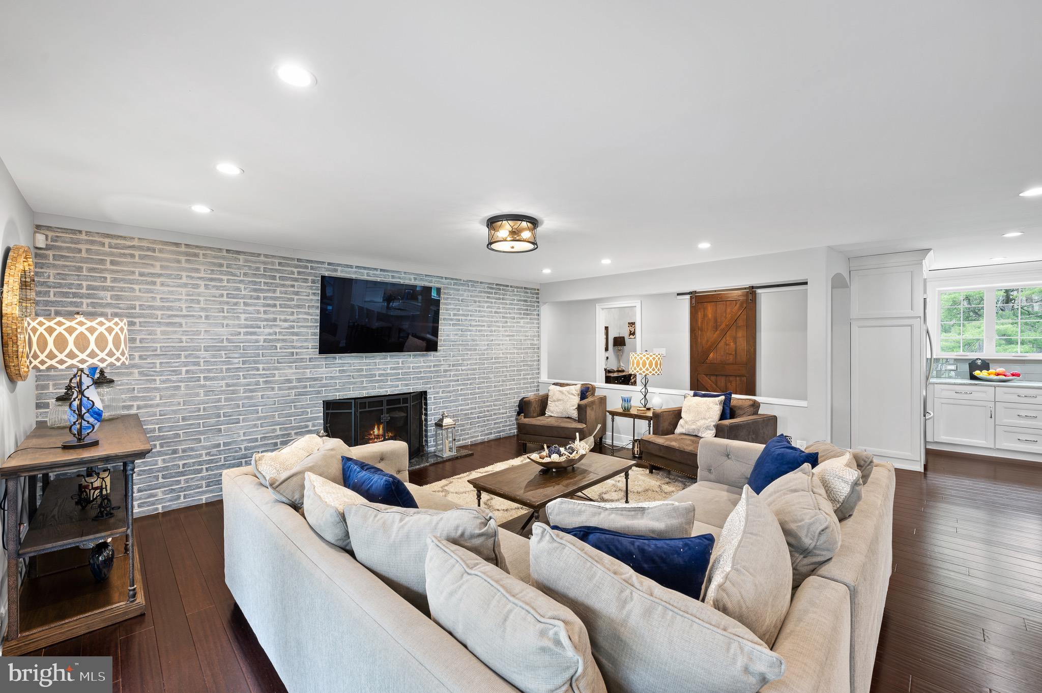 13 Laurel Circle Malvern, PA 19355 - Photo 22 of 84 Family Room with Dramatic Brick Accent Wall