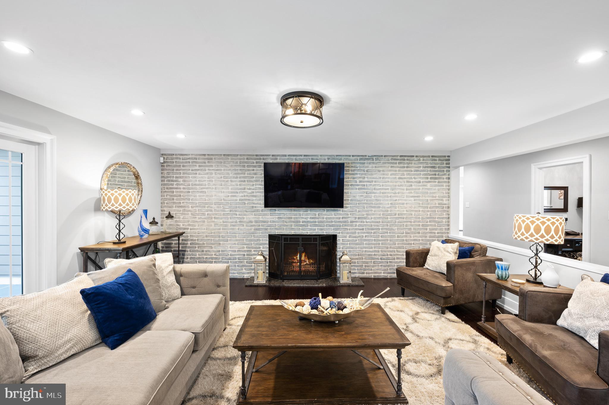 13 Laurel Circle Malvern, PA 19355 - Photo 23 of 84 Family Room with Brick Accent Wall